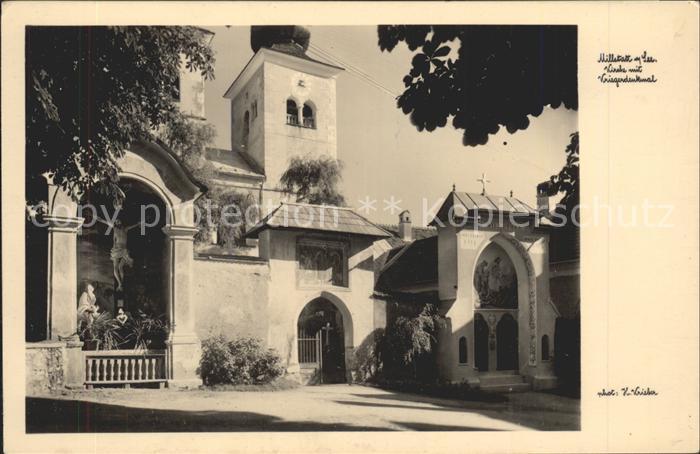 Millstatt Millstaettersee Kirche mit Kriegerdenkmal