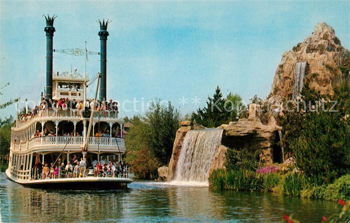 Disneyland California The Mark Twain steamboat passes Cascade Peak and waterfall