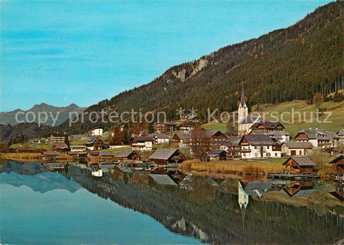 Techendorf Weissensee Ortsansicht mit Kirche Badesee Wasserspiegelung