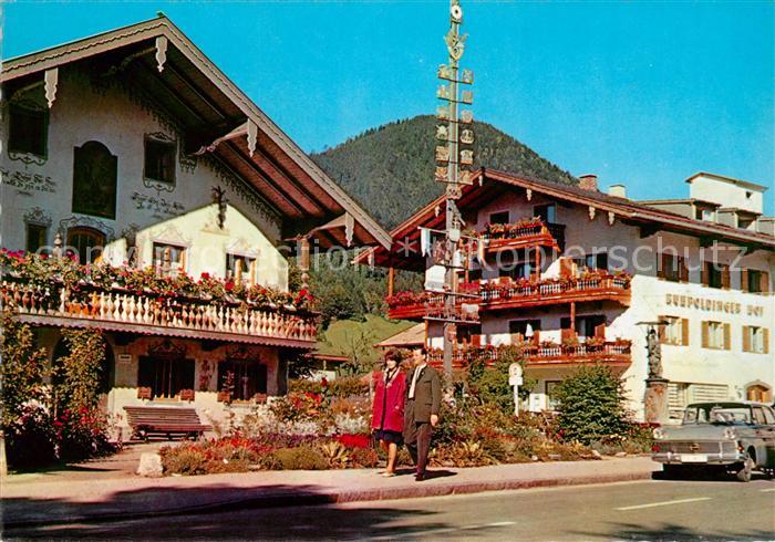 Ruhpolding Dorfplatz mit Maibaum Hotels