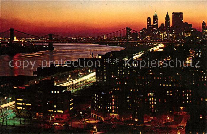 New York City by night looking south Manhattan Brooklyn Bridge East River Downto