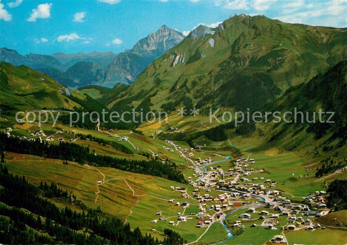 Lech Vorarlberg mit Biberkopf und Mittagspitze Alpenpanorama Fliegeraufnahme