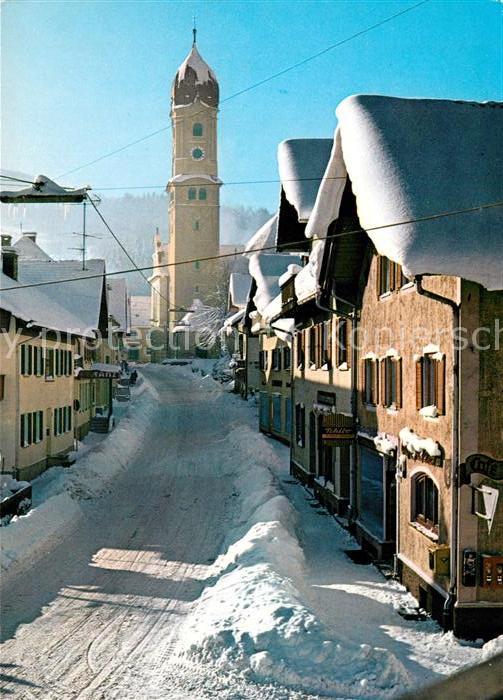 Nesselwang Ortsmotiv mit Blick zur Kirche im Winter