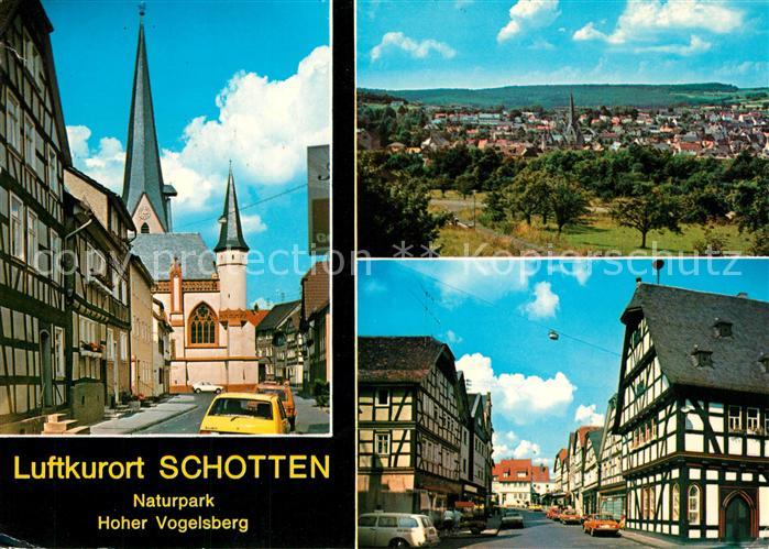 Schotten Hessen Ortsmotiv mit Kirche Fachwerkhaeuser Stadtpanorama Luftkurort Na