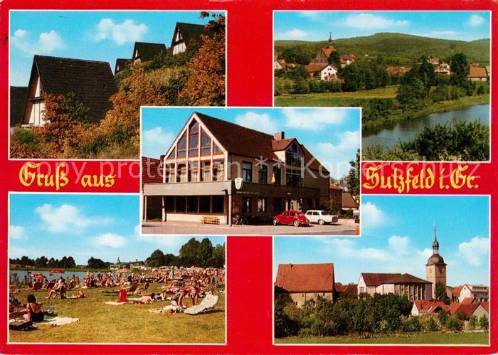 Sulzfeld Grabfeld Ferienhaeuser Hotel Liegewiese am Badesee Ortsmotiv mit Kirche
