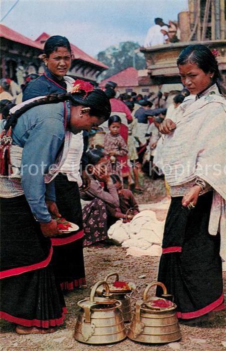 Kathmandu Typical women of Kathmandu valley preparing for worship