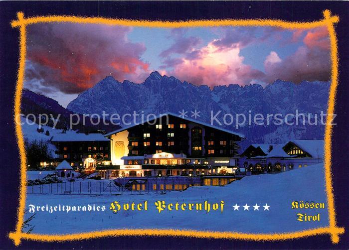Koessen Tirol Freizeitparadies Hotel Peternhof im Winter Abendstimmung Alpen