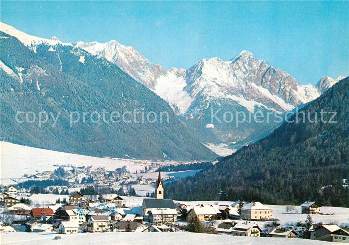 Oberolang Pustertal Gesamtansicht mit Alpenpanorama im Winter