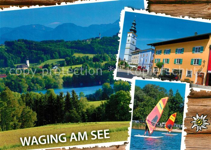 Waging See Ortsmotiv mit Kirche Windsurfen Landschaftspanorama Alpen