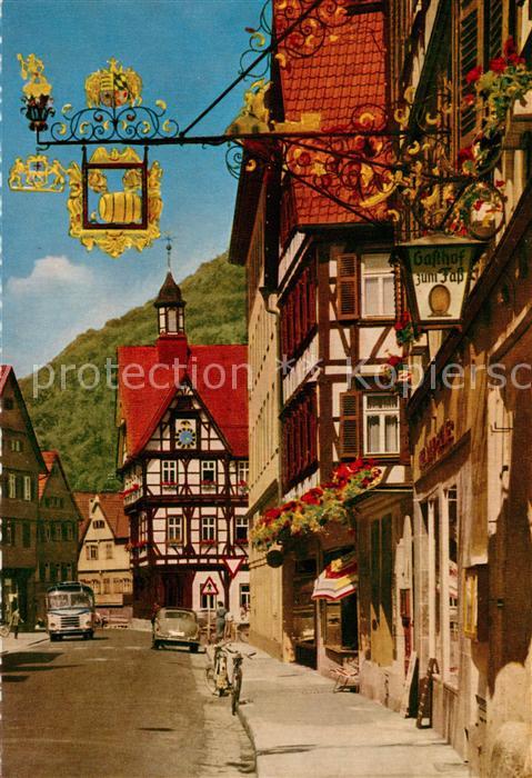 Bad Urach Wilhelmstrasse mit Rathaus Tuerschild Gasthof Altstadt Fachwerkhaeuser