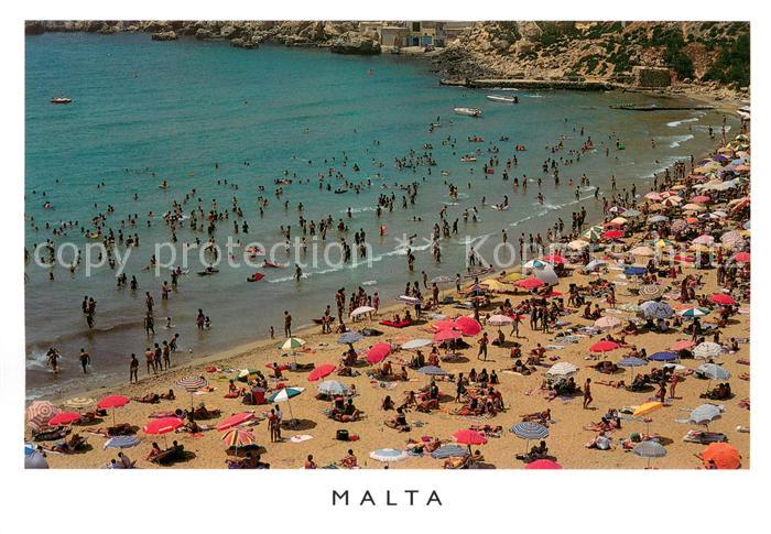 Malta Ghain Tuffieha Bay dottet with bathers on a fine summerys day