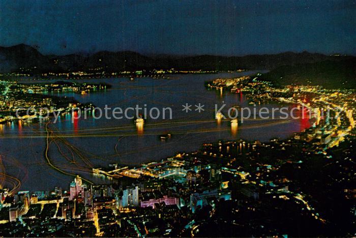 Hong Kong and Kowloon by night aerial view
