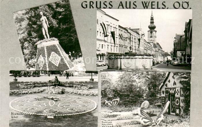 Wels Ortszentrum Brunnen Knusperhaeuschen Volksgarten Blumenuhr Statue