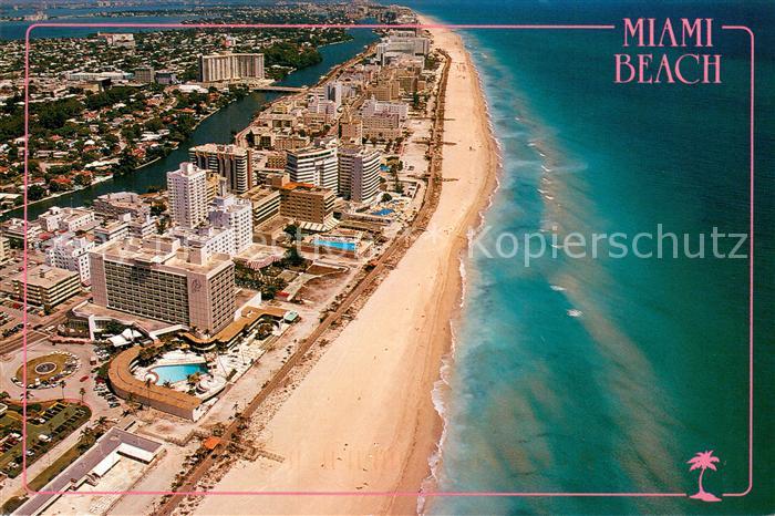 Miami Beach looking north with wide beaches and boardwalk Atlantic Ocean aerial