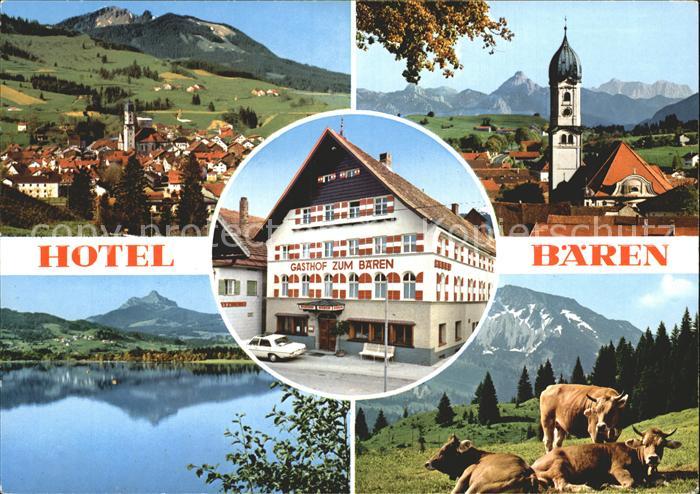 Nesselwang Allgaeu Bayern Teilansicht Kirche See Kuehe Gasthof zum Baeren