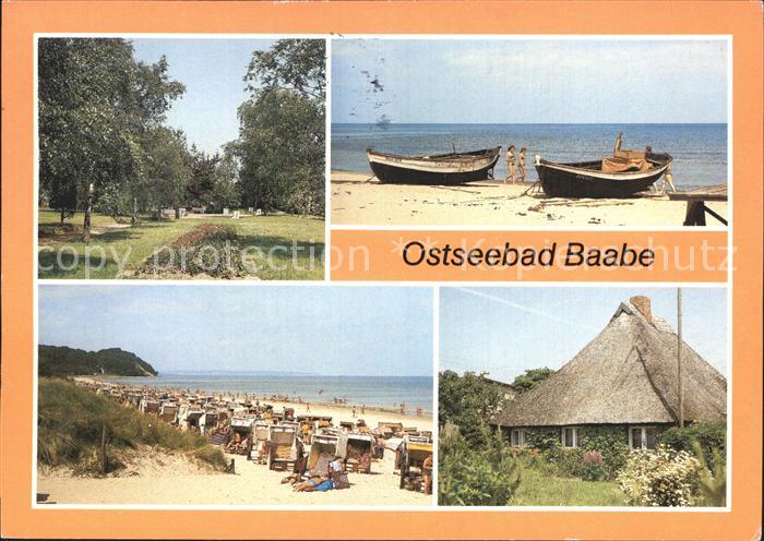 Baabe Ostseebad Ruegen Kurpark Boote am Strand Rohrdachhaus