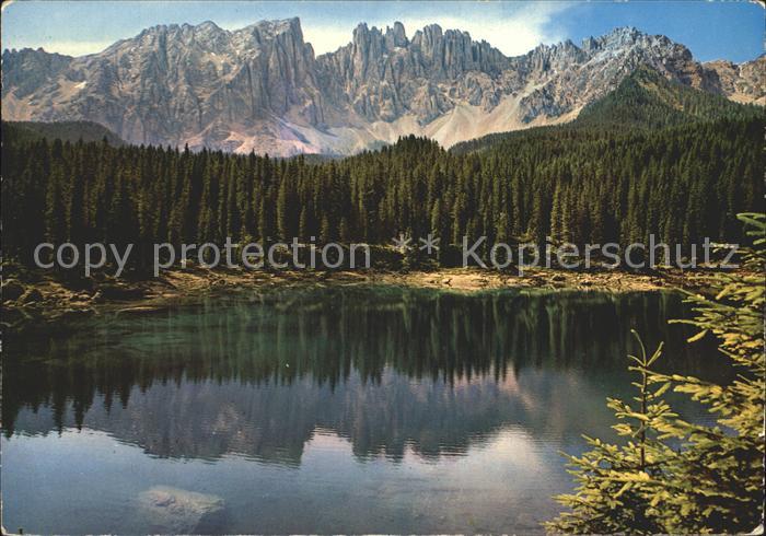 Karersee Suedtirol mit Latemar Dolomiten Wasserspiegelung