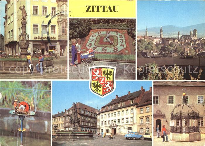 Zittau Brunnen Blumenuhr Teilansicht Schleifermaennchen August Bebel Platz Gruen