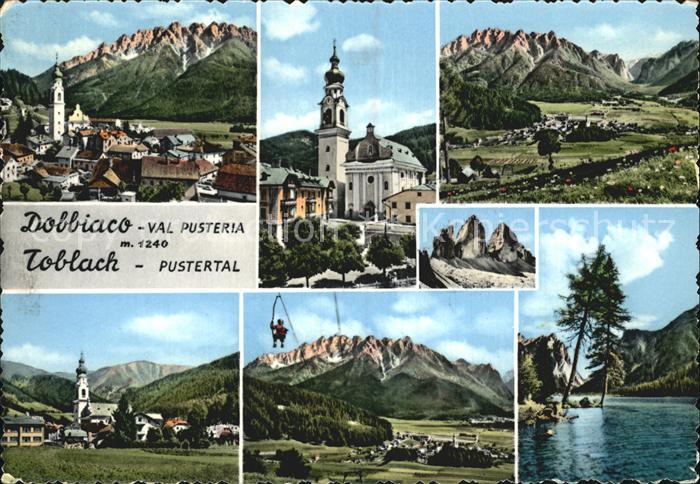 Dobbiaco Pustertal Suedtirol Ortsansicht mit Kirche Alpenpanorama