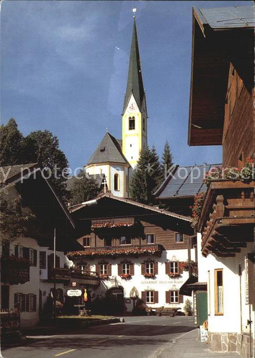 Kirchberg Tirol Hauptstrasse mit Unterrainwirt Gaststaette Kirche