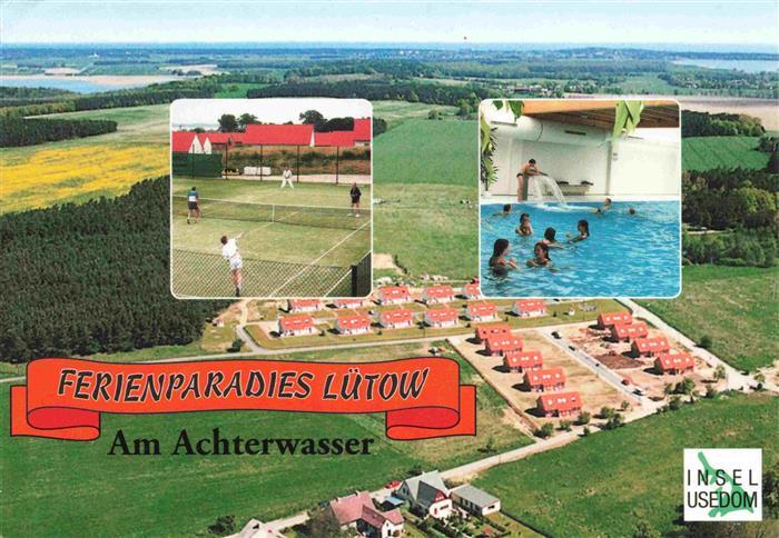 Luetow Ferienparadies am Achterwasser Ferienhaeuser Luftaufnahme Tennisplatz Hal