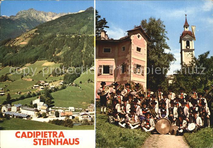 Cadipietra Steinhaus Panorama Alpen Kirchturm Musikkapelle Trachten