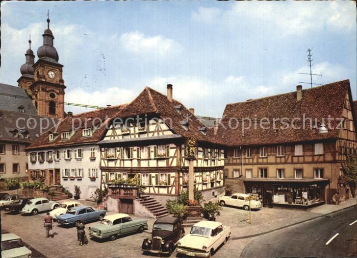 Amorbach Miltenberg Platz Saeule Fachwerkhaus Kirchtuerme Luftkurort im Odenwald