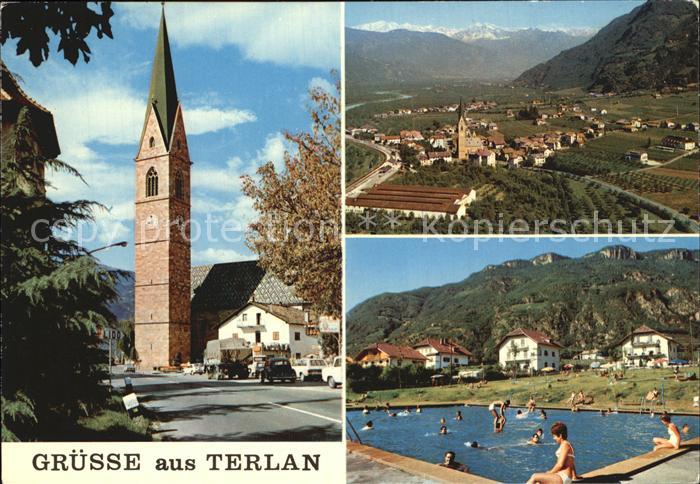 Terlano Suedtirol Gesamtansicht mit Alpenpanorama Kirchturm Freibad Schwimmbad