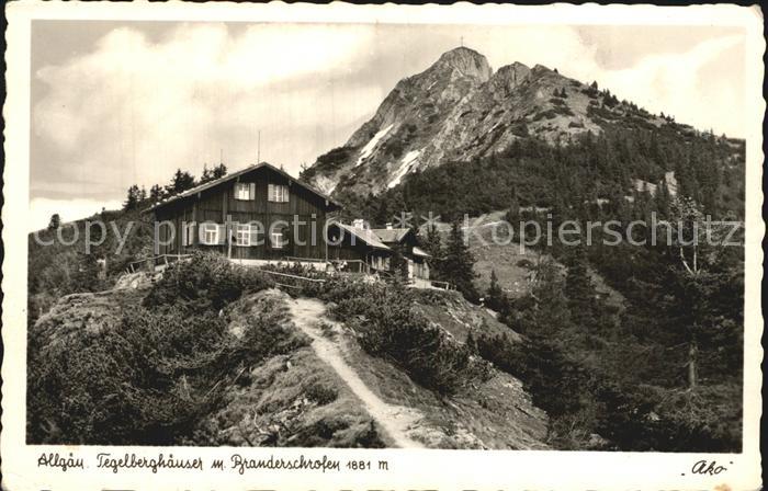 Pfronten Ostallgaeu Bayern Tegelberghaeuser mit Branderschrofen