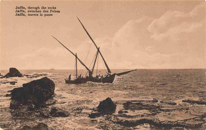Jaffa Tel-Aviv Israel through the rocks fishing boat