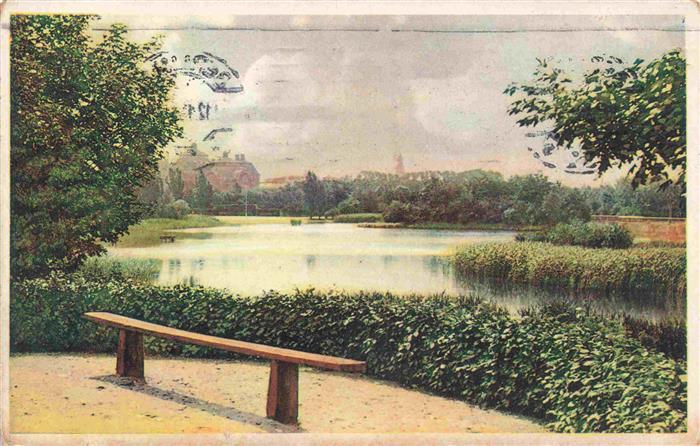 Malmoe  Sweden Slottsparken Teich Bank Baeume Park Kirchturm