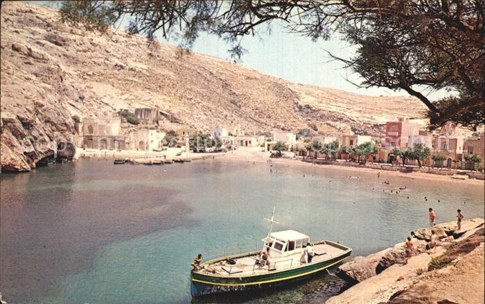 Gozo Malta Xlendi Bay Sandy beach with towering cliffs on both side