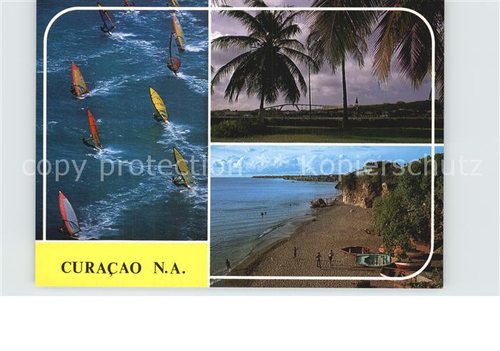 Curacao Niederlaendische Antillen Panorama Strand Kueste Palmen Windsurfen