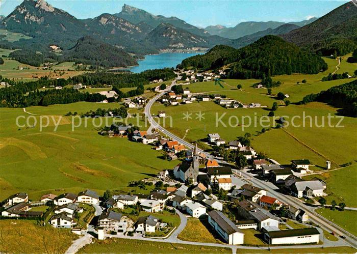 Hof Salzburg mit Fuschlsee Schober und Schafberg Fliegeraufnahme