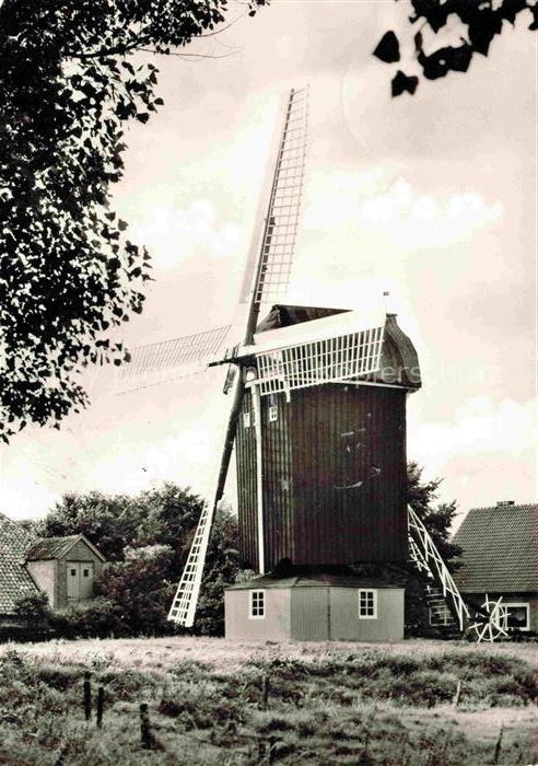 Dornum Ostfriesland Niedersachsen Windmuehle Fluegel Holzmuehle Baum Wohngebaeud