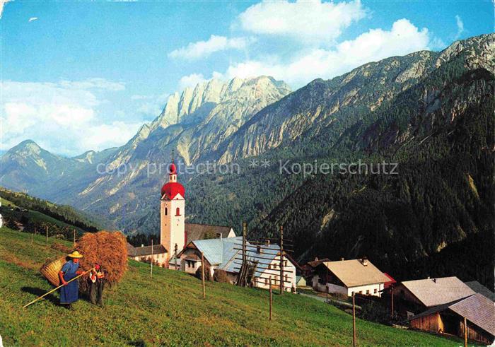 Assling Tirol AT Kirchturm Lienzer-Dolomiten Pustertal Heuernte Bergdorf Wiesen