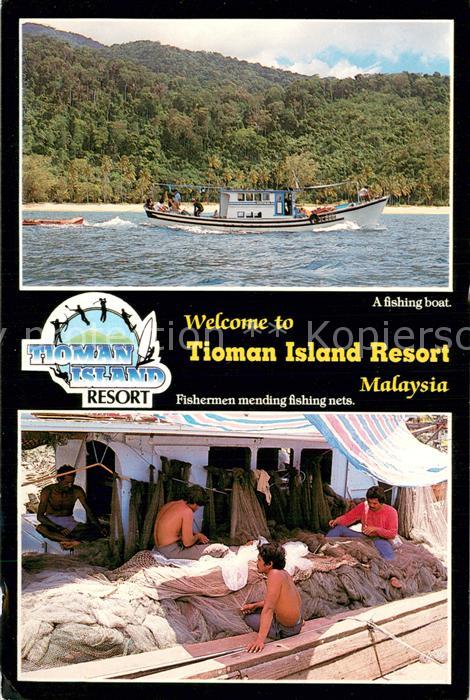 Johor Tioman Island Resort Fishing boat Fishermen mending fishing nets