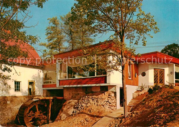 Bad Iburg Cafe Schlossmuehle Haupteingang mit Muehlrad