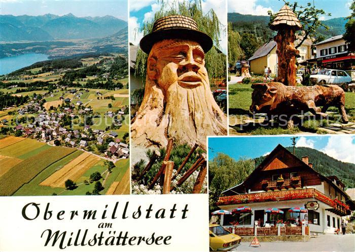 Obermillstatt Kaernten AT am Millstaettersee Geschnitzte Figuren Gasthaus