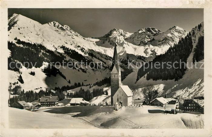 Mittelberg Kleinwalsertal Ortsansicht mit Kirche Winterpanorama mit Schafalpkoep