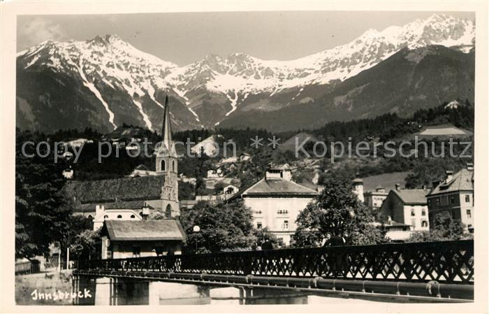 Innsbruck Ortsmotiv mit Bruecke und Kirche Alpen