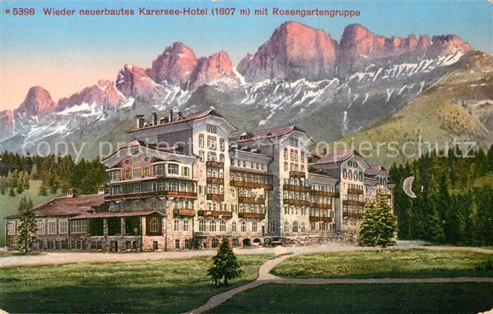 Karersee Suedtirol Wieder neuerbautes Karersee Hotel mit Rosengartengruppe Dolom