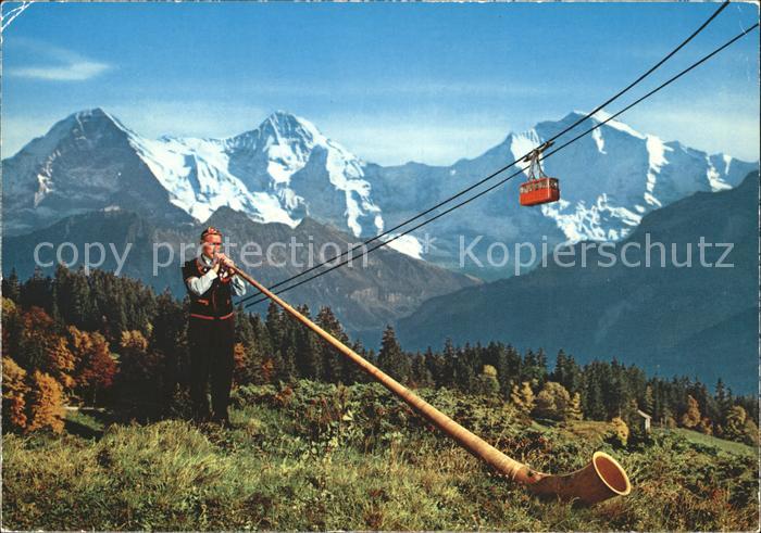 Alphorn Alphornblaeser Seilbahn Berner Oberland Eiger Moench Jungfrau