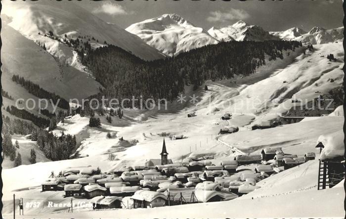 Rueras Ortsansicht mit Kirche Winterpanorama Alpen