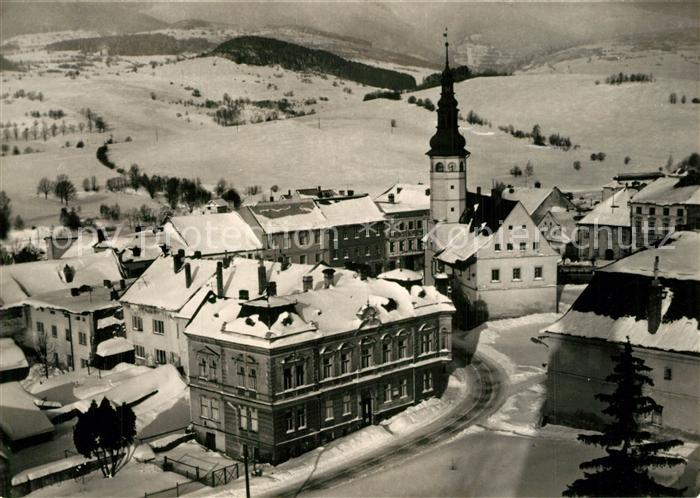 Stare Mesto pod Sneznikem Ortsansicht mit Kirche Winterpanorama