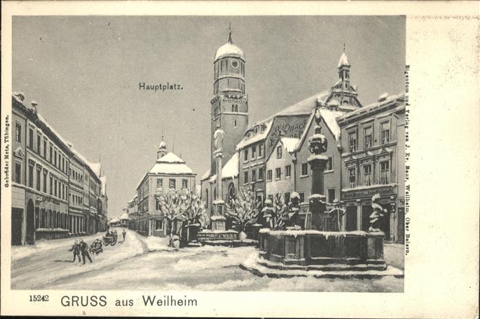 Weilheim Oberbayern Hauptplatz Brunnen Ski Schlitten Winter