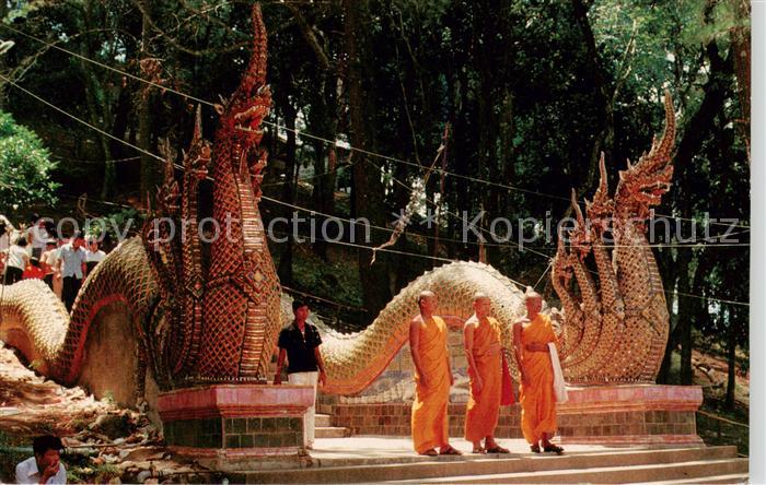 Chiang Mai Thailand Three Buddhists monks post on ground fl