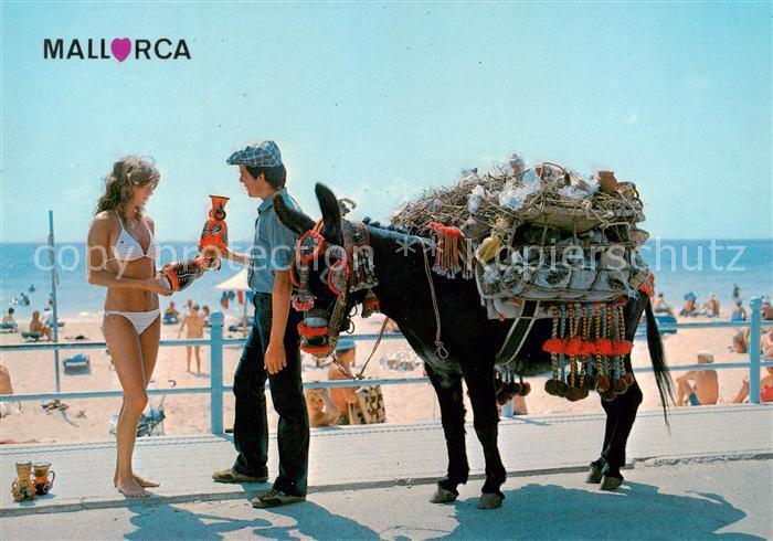 Mallorca ES Strandpartie Strassenhaendler mit Esel