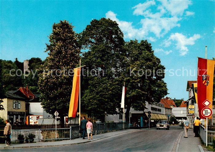 Bad Soden-Salmuenster Salz-Bruecke mit Kaufhaus und Burgruine Fahnen