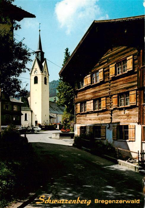 Schwarzenberg Vorarlberg Altes Bregenzerwaelderhaus mit Kirche